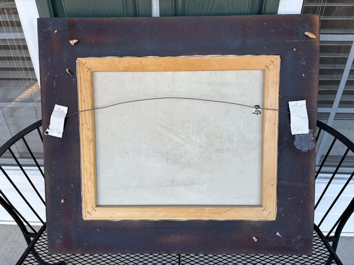 Beautiful signed painting of dog chasing a butterfly in ornate frame!