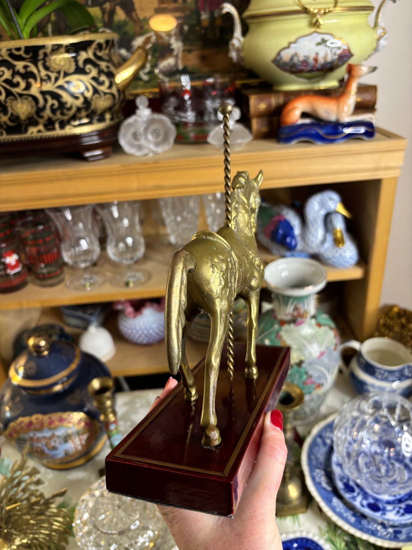 Brass carousel horse on wood!