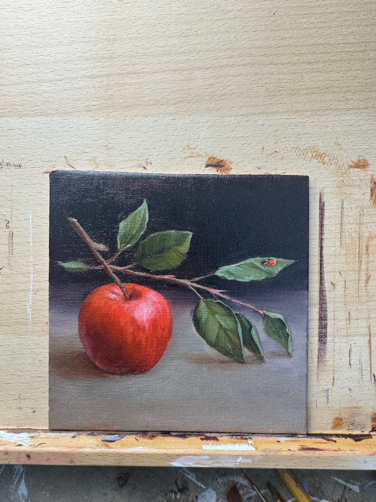 Apple and lady bug original oil painting 9.5x9.5”