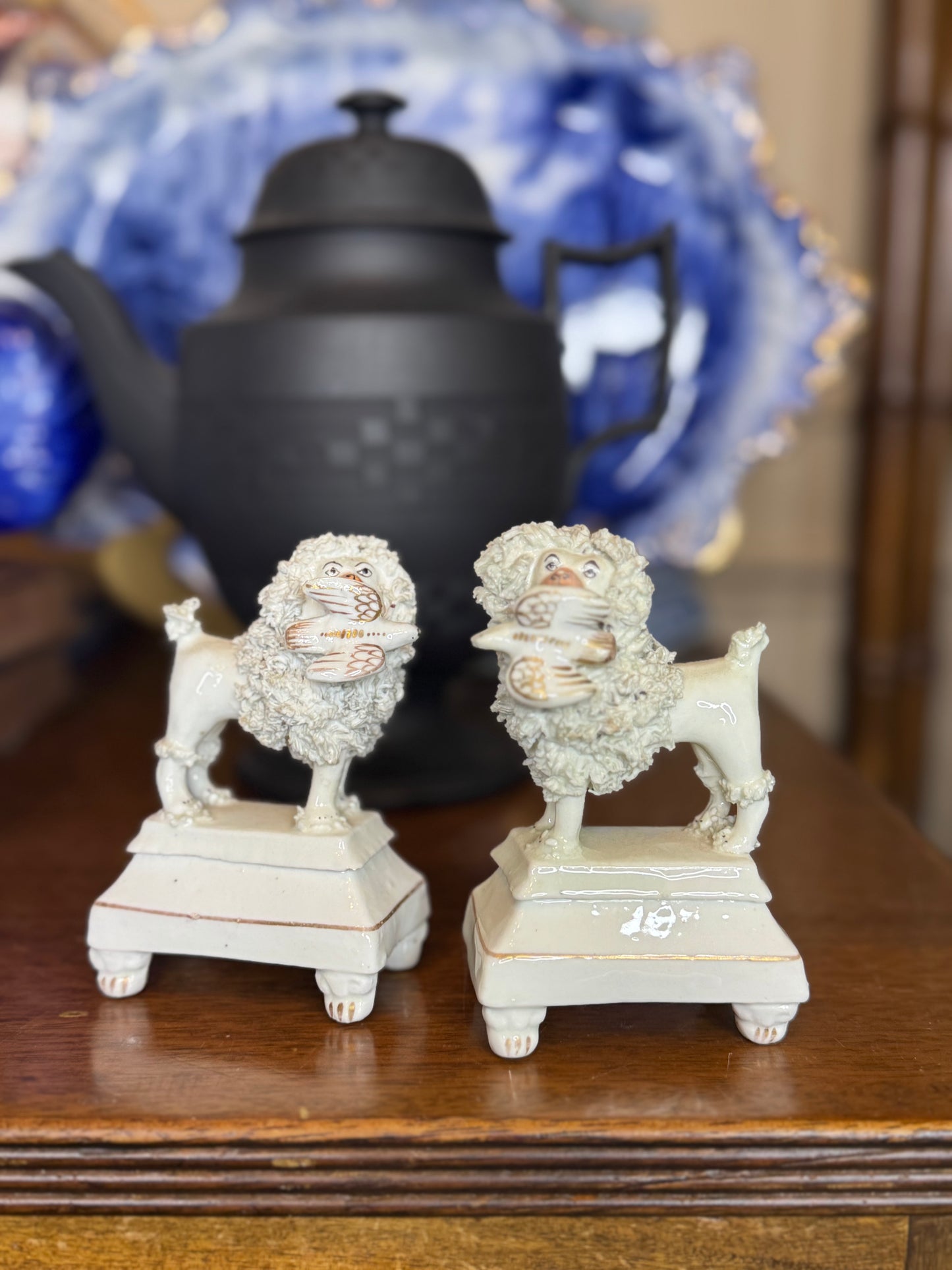Pair of 19th century small poodles on bases with birds in their mouths STYLE #DA4482