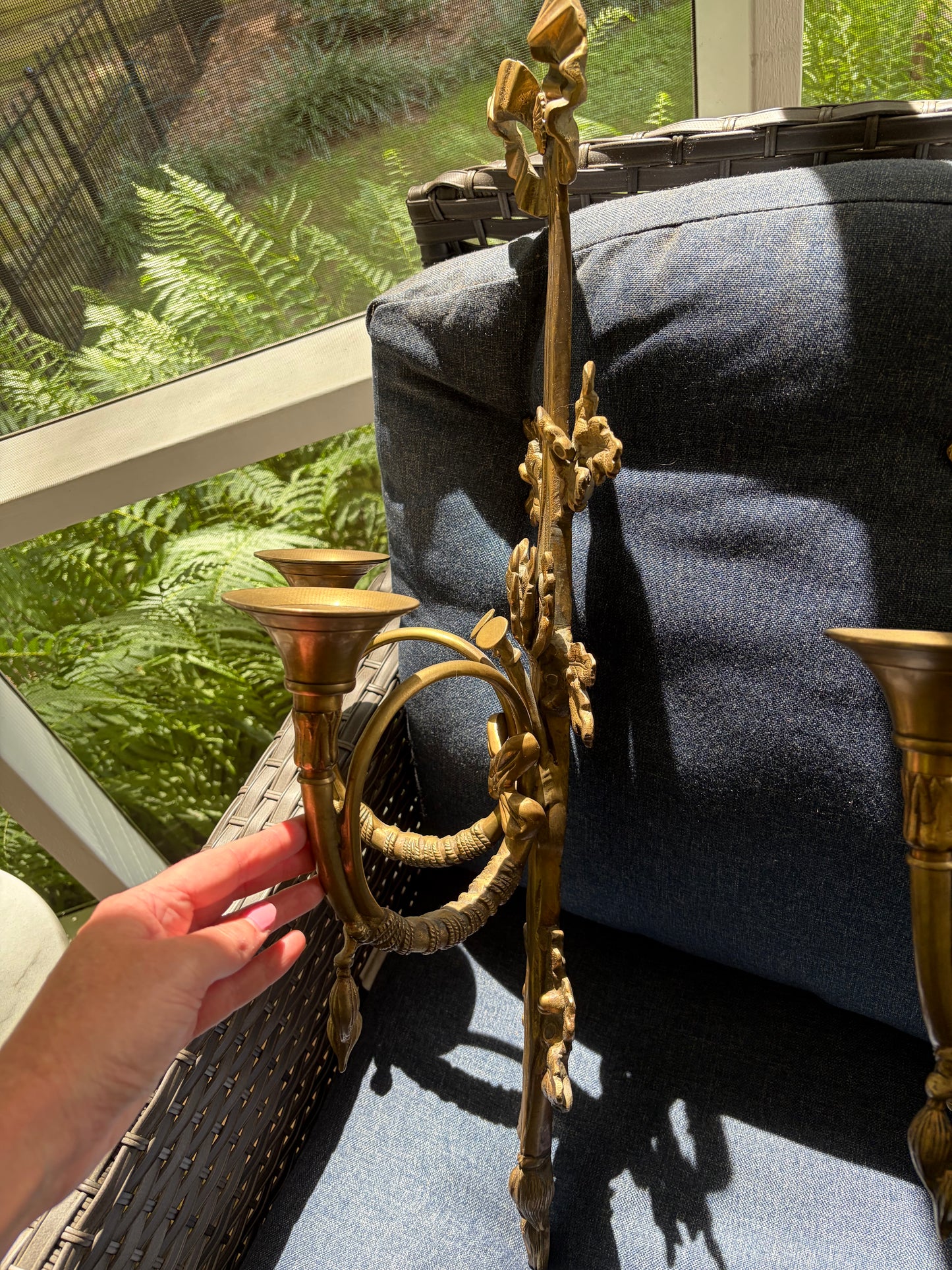 Stunning antique pair of French Louis XVI style brass wall sconces with bows, tassels, and horn motif designs!