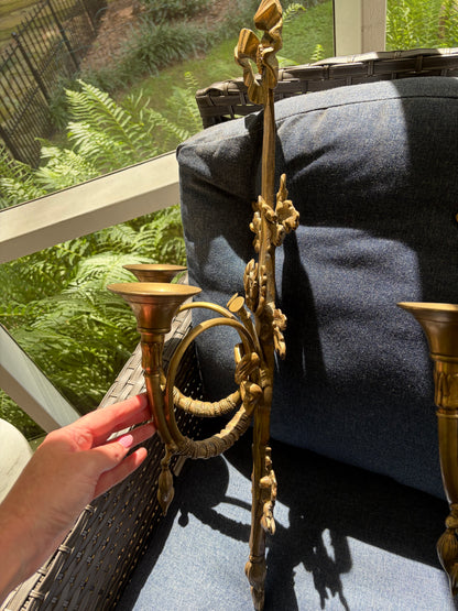 Stunning antique pair of French Louis XVI style brass wall sconces with bows, tassels, and horn motif designs!