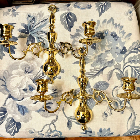 Stunning pair of Hollywood Regency brass double wall candelabras.
