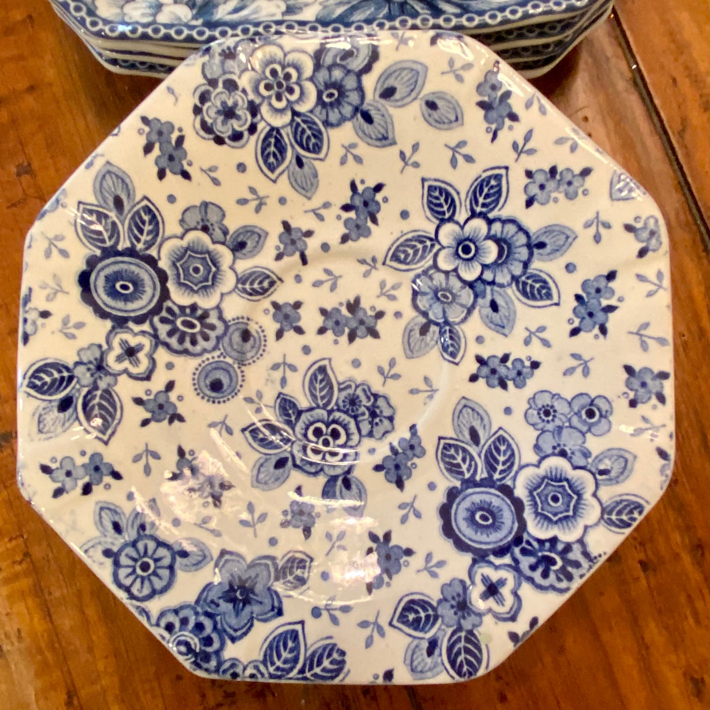 Set of 4 vintage floral blue and white saucer plates