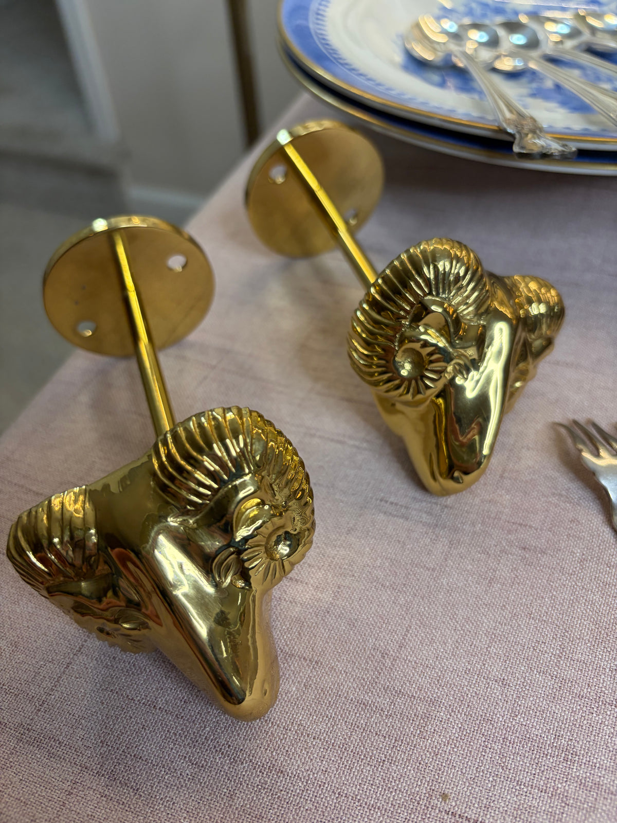 Lovely brass ram’s head brass curtain tie backs!