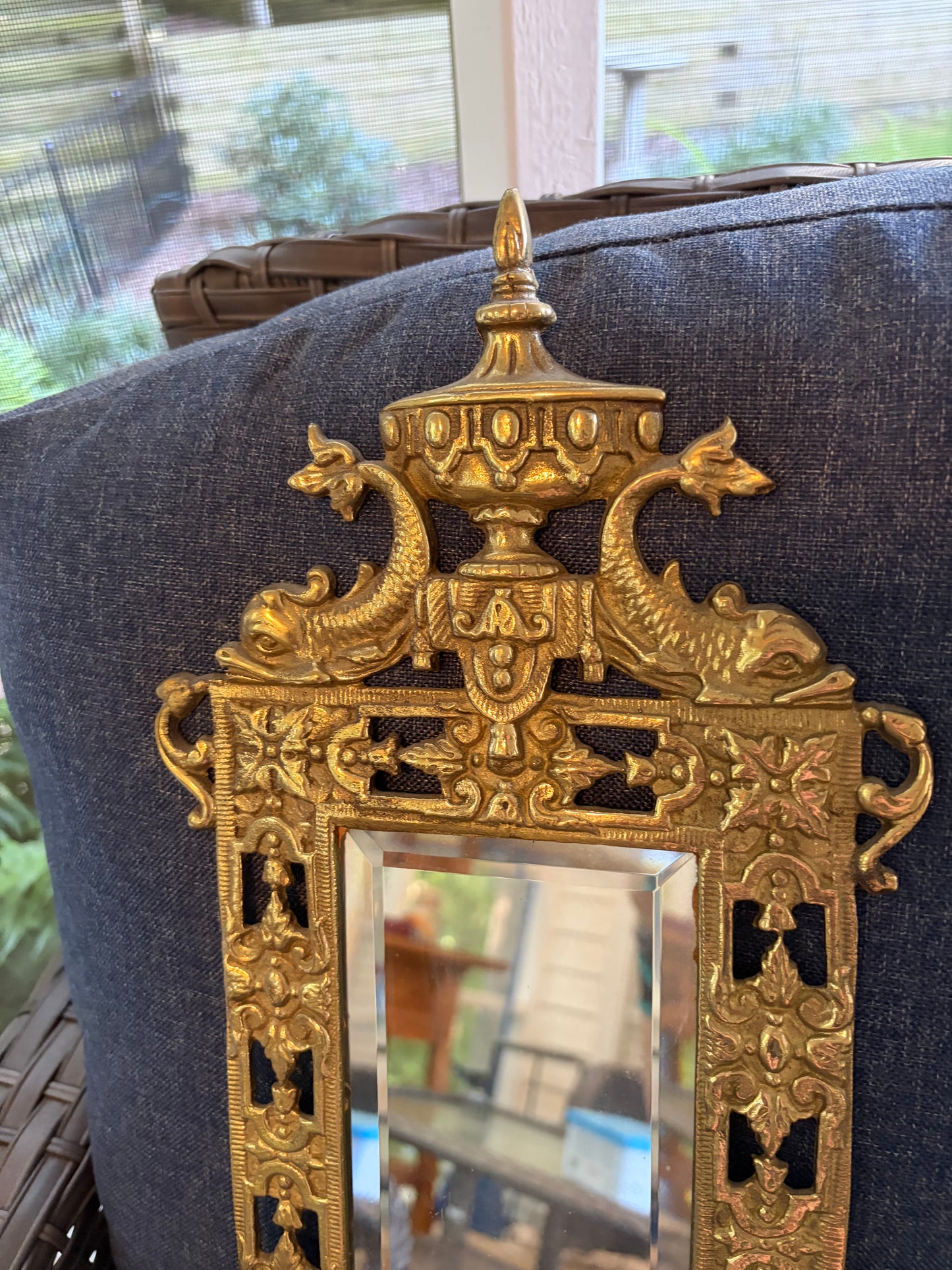 Stunning mirrored brass sconces pair with koi fish, ornate details, and tassel design!