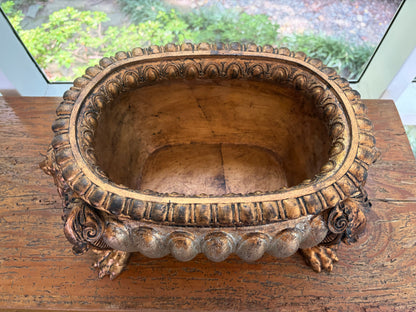 Striking composite lion head and claw feet footbath planter!