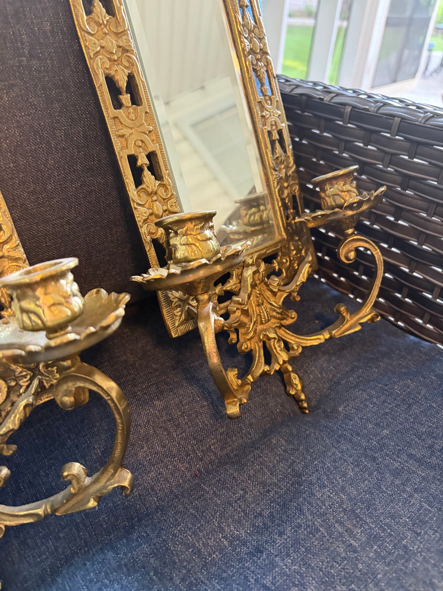 Stunning mirrored brass sconces pair with koi fish, ornate details, and tassel design!