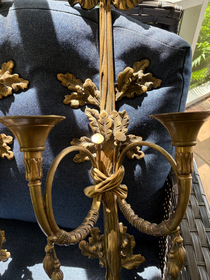 Stunning antique pair of French Louis XVI style brass wall sconces with bows, tassels, and horn motif designs!