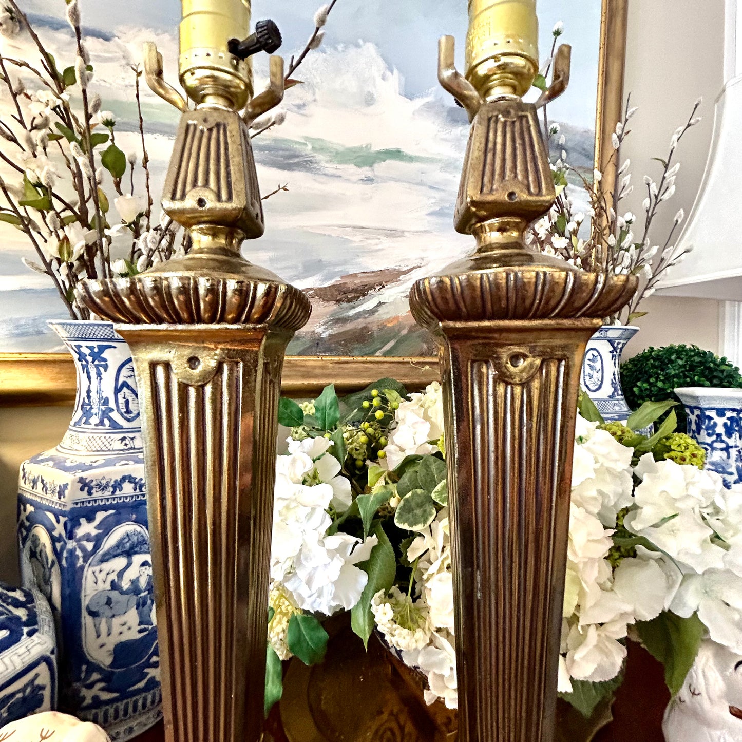 Stunning Pair of vintage neoclassical aged brass lamps.