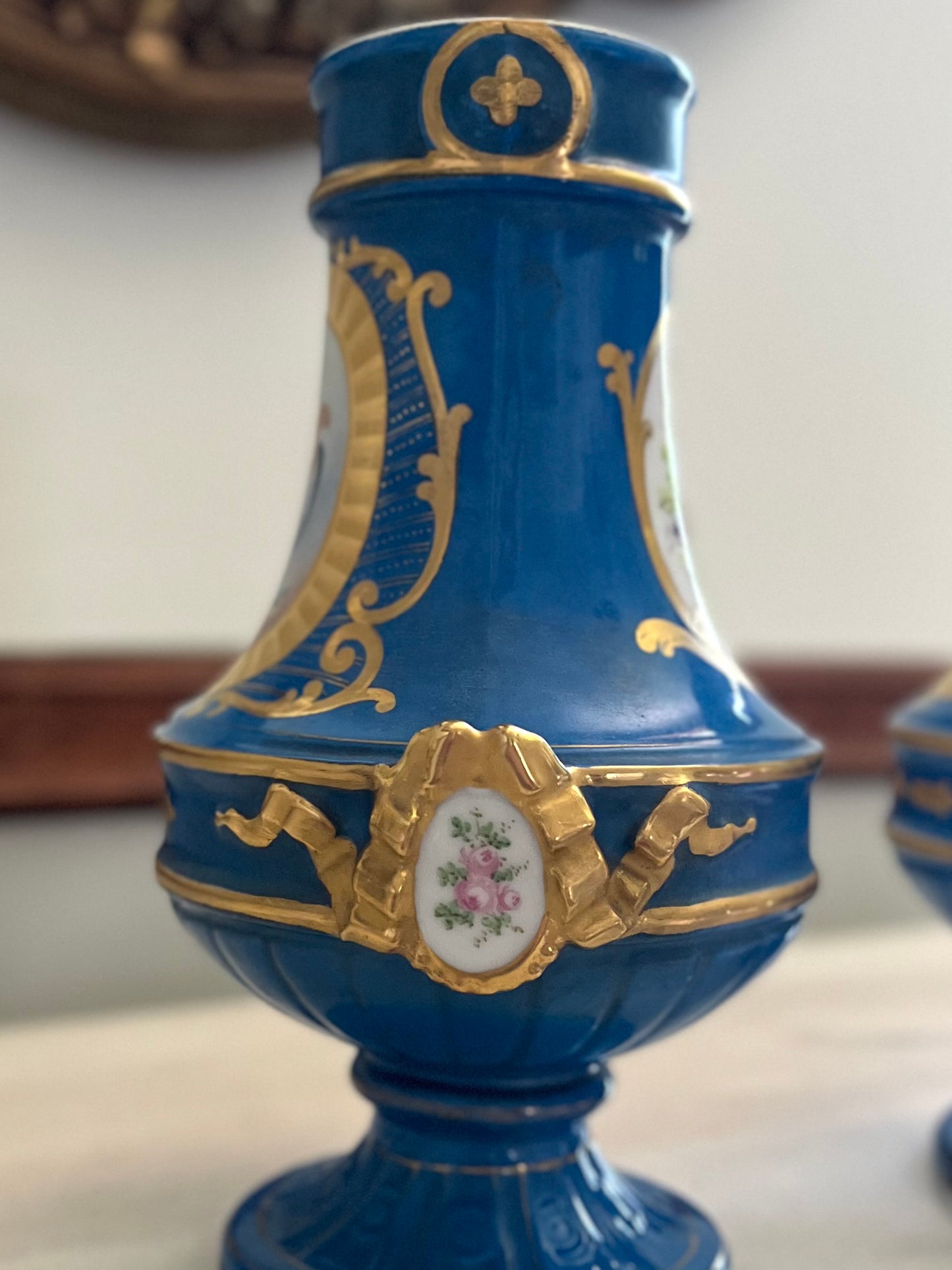Elegant Pair of Antique 19th Century French Sèvres Style Porcelain Vases In Céleste Bleu With Hand-Painted Putti And Florals