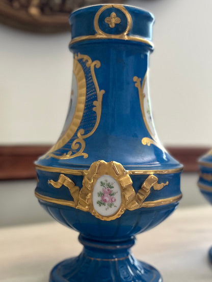 Elegant Pair of Antique 19th Century French Sèvres Style Porcelain Vases In Céleste Bleu With Hand-Painted Putti And Florals