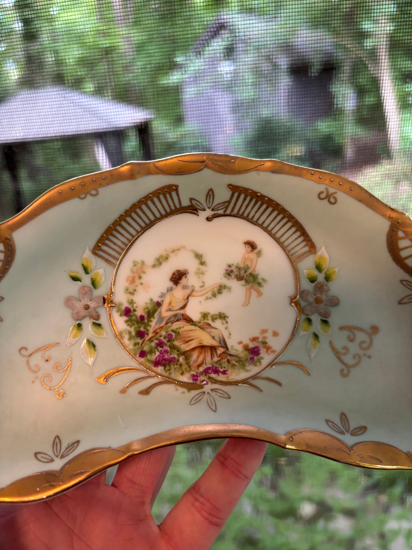 Lovely handpainted crescent dish with gold details!