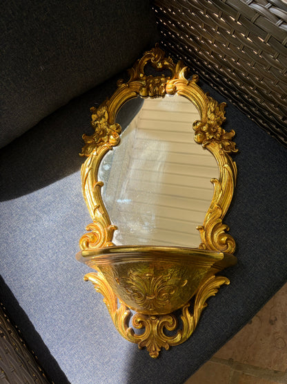 Beautiful Syroco wall mirror with an integrated shelf featuring an ornate gilt gold frame!