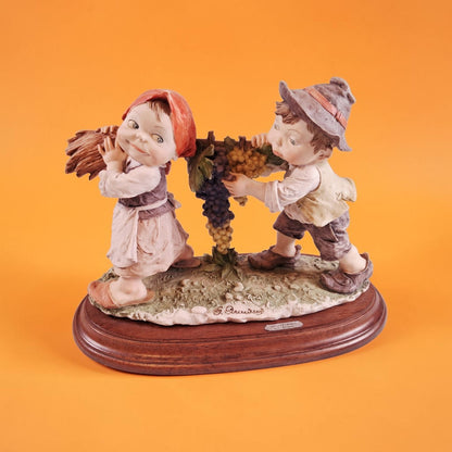 Authentic Boy and Girl Figurine on Wood Base, Signed by Artist