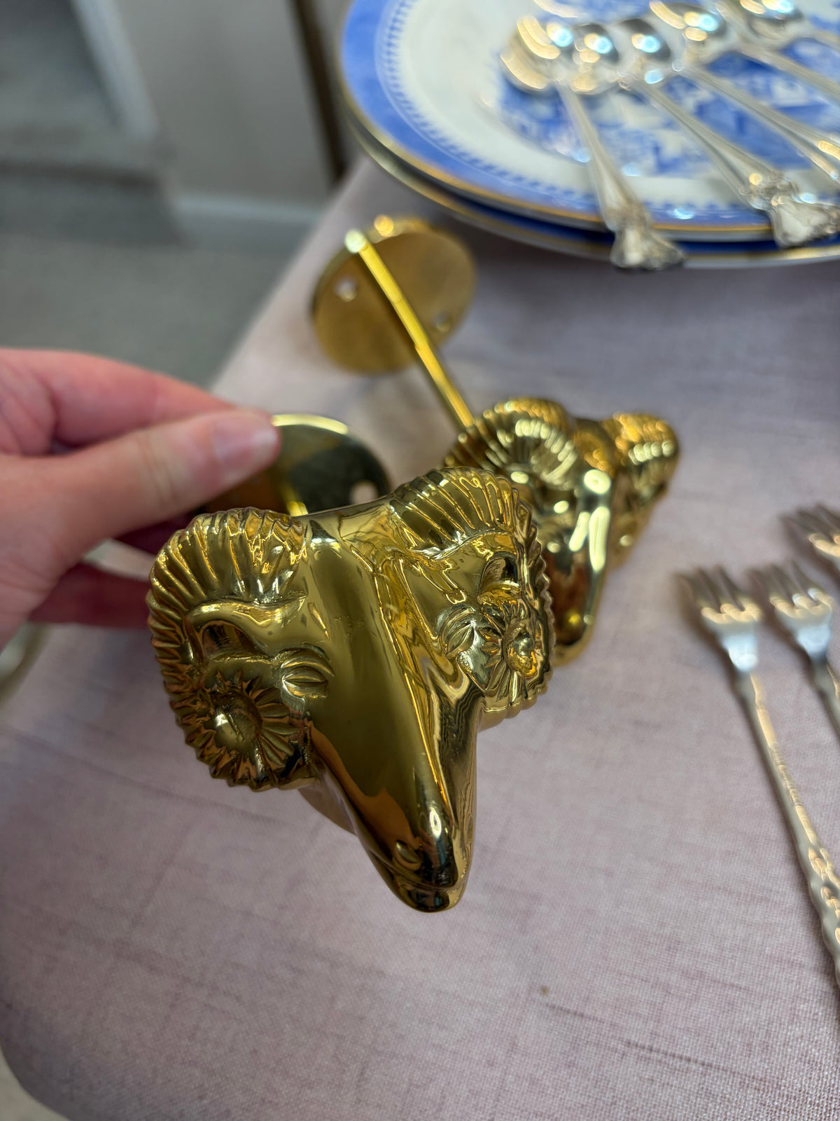Lovely brass ram’s head brass curtain tie backs!
