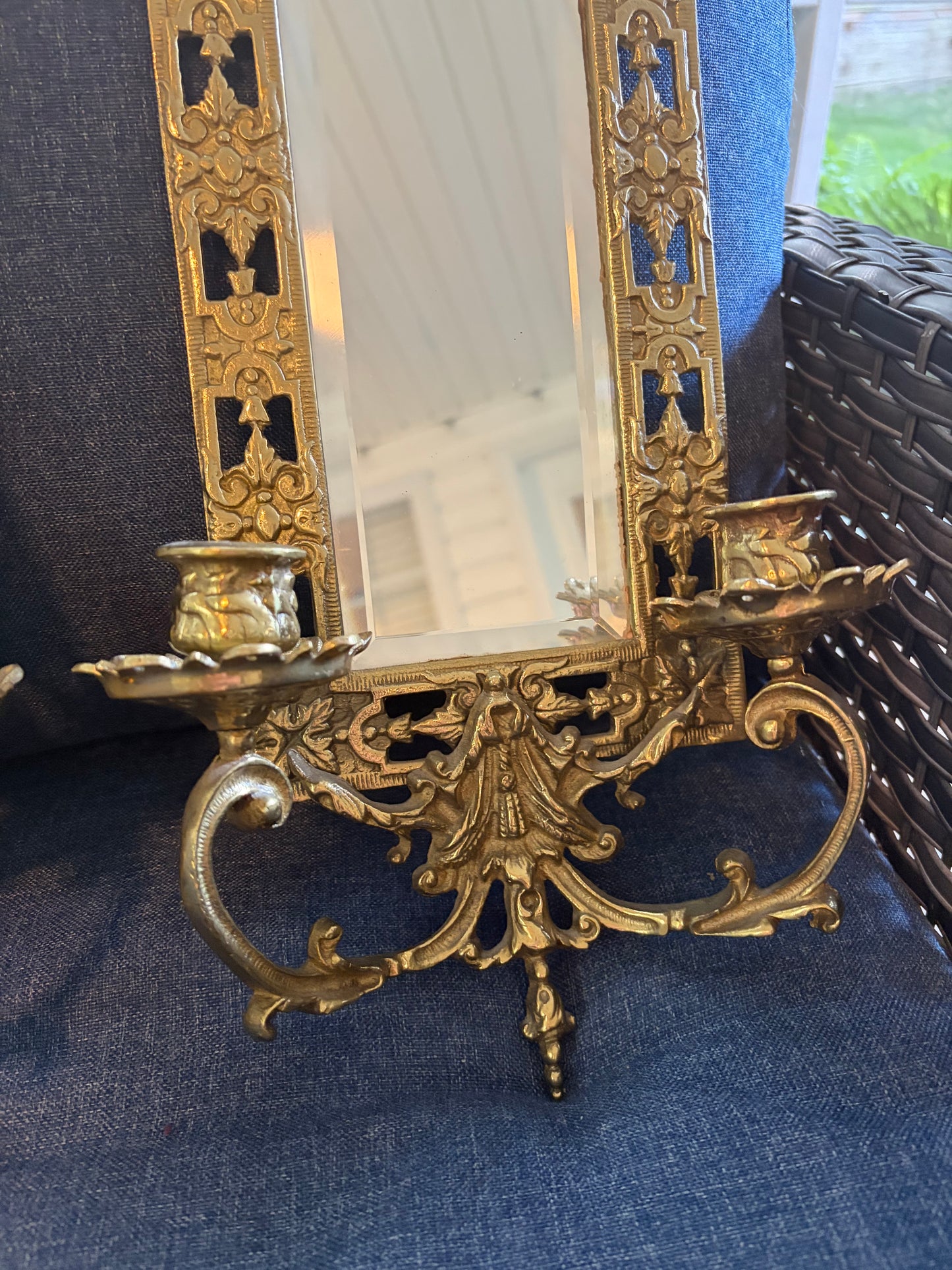 Stunning mirrored brass sconces pair with koi fish, ornate details, and tassel design!