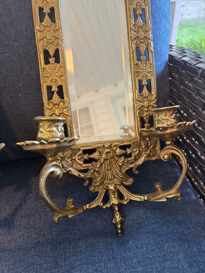 Stunning mirrored brass sconces pair with koi fish, ornate details, and tassel design!