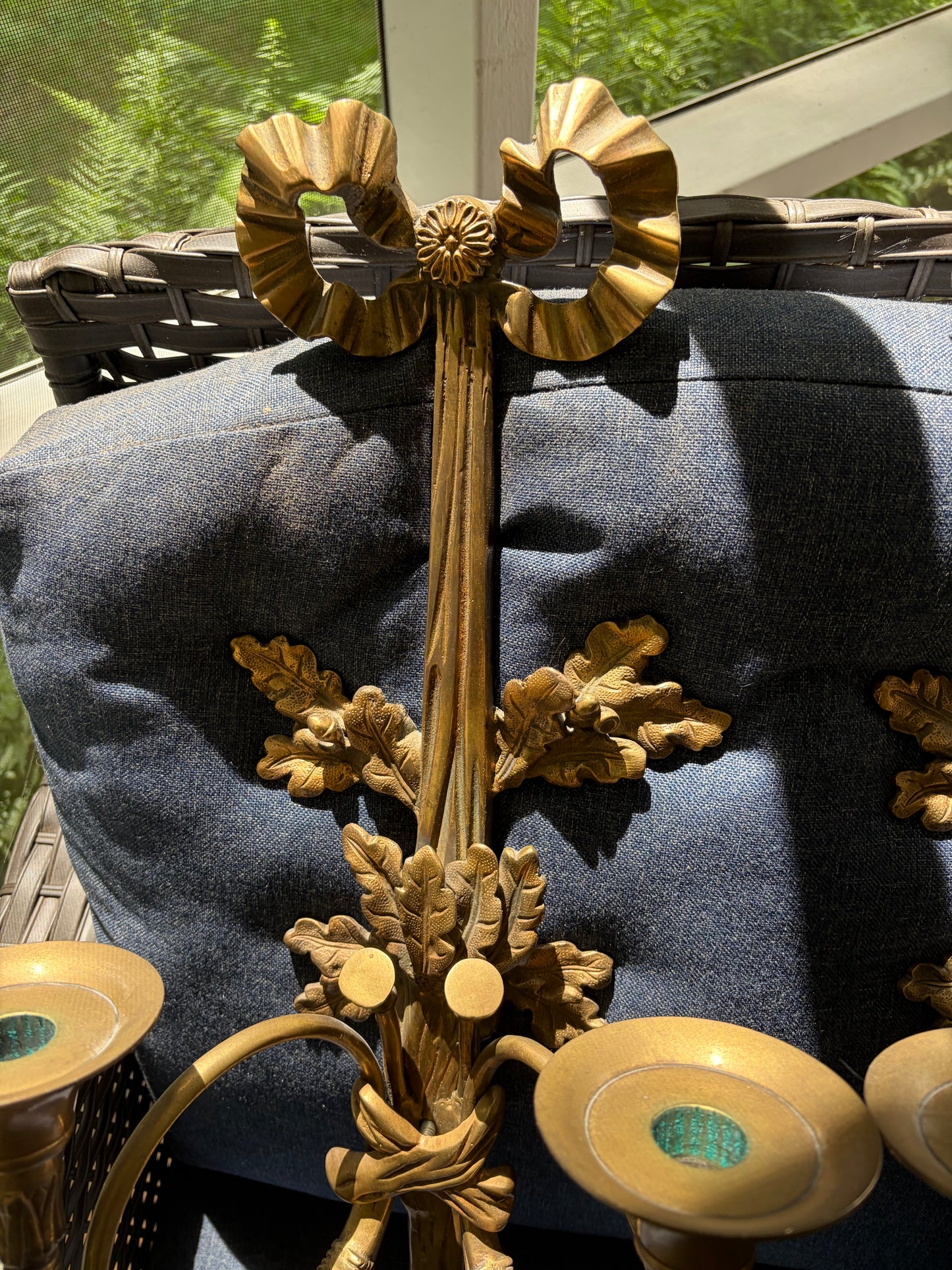 Stunning antique pair of French Louis XVI style brass wall sconces with bows, tassels, and horn motif designs!