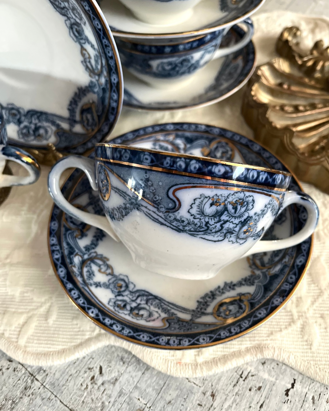 Romantic Set of 6/19th Century Royal Staffordshire “Reknown” Flow Blue Gilded Broth Cups and Saucers