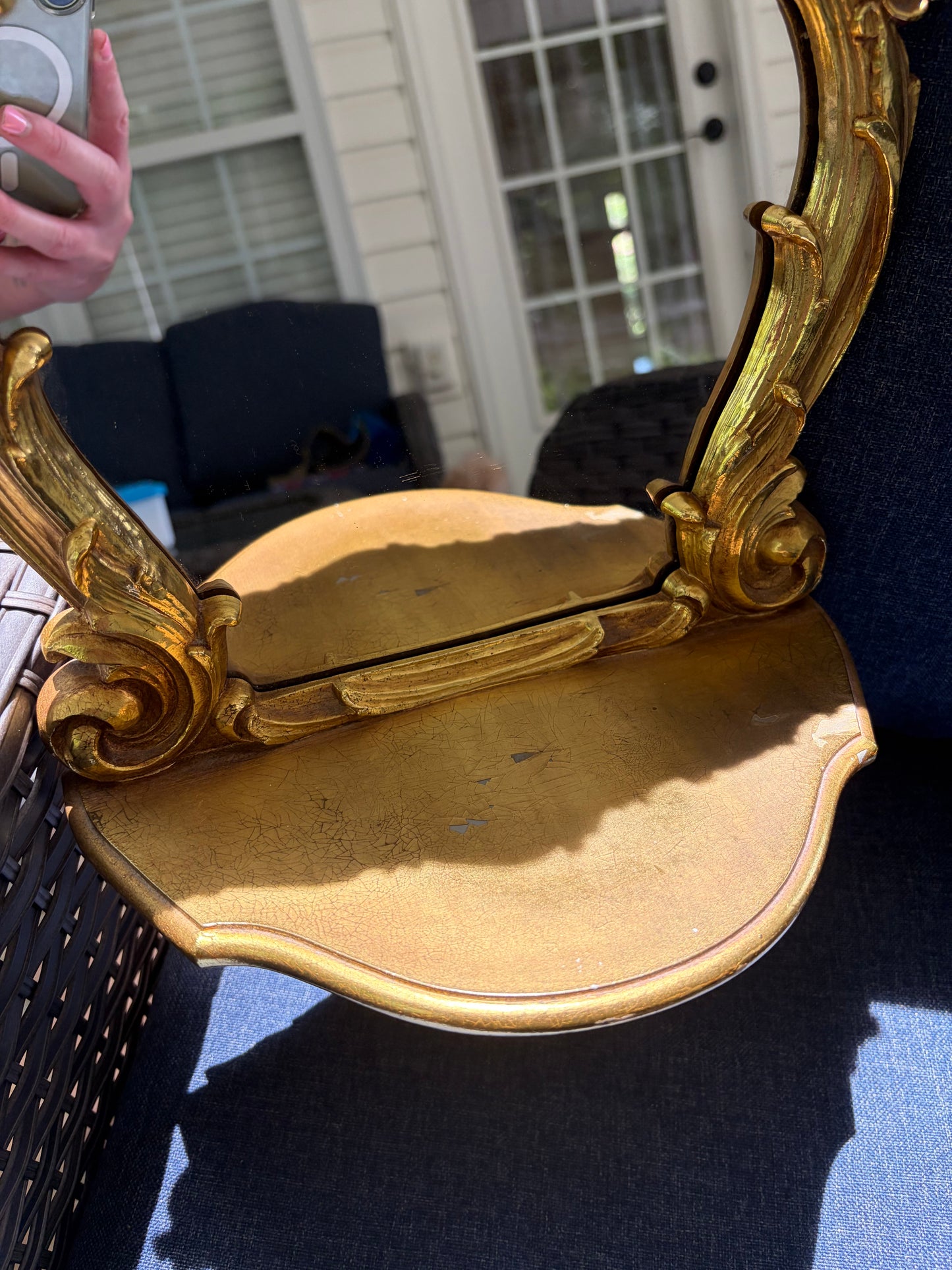 Beautiful Syroco wall mirror with an integrated shelf featuring an ornate gilt gold frame!