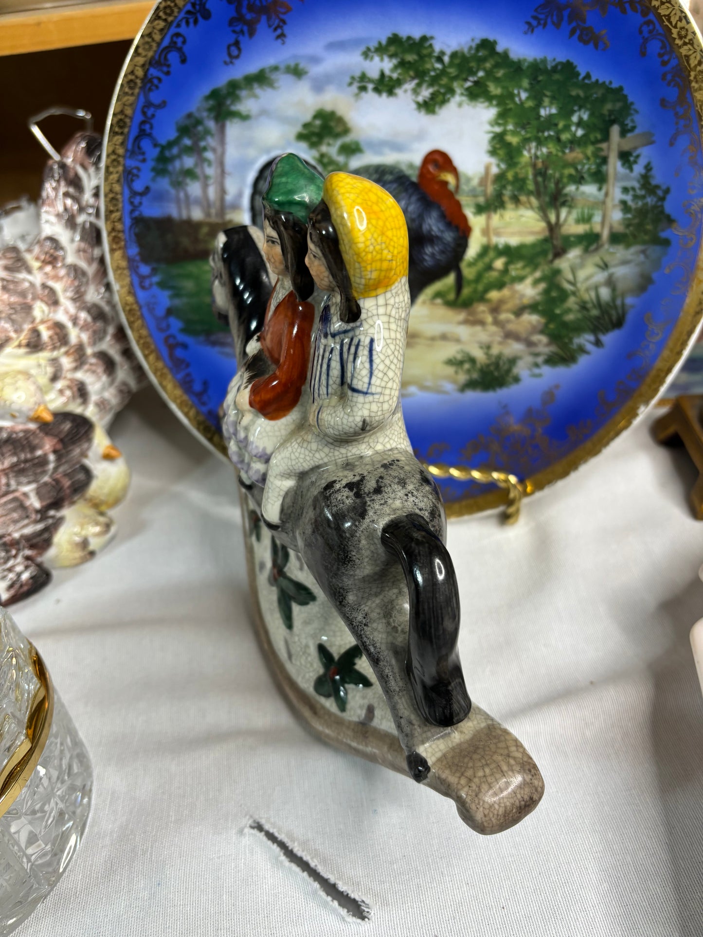 Staffordshire couple on rocking horse!