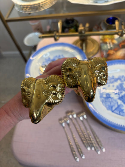 Lovely brass ram’s head brass curtain tie backs!