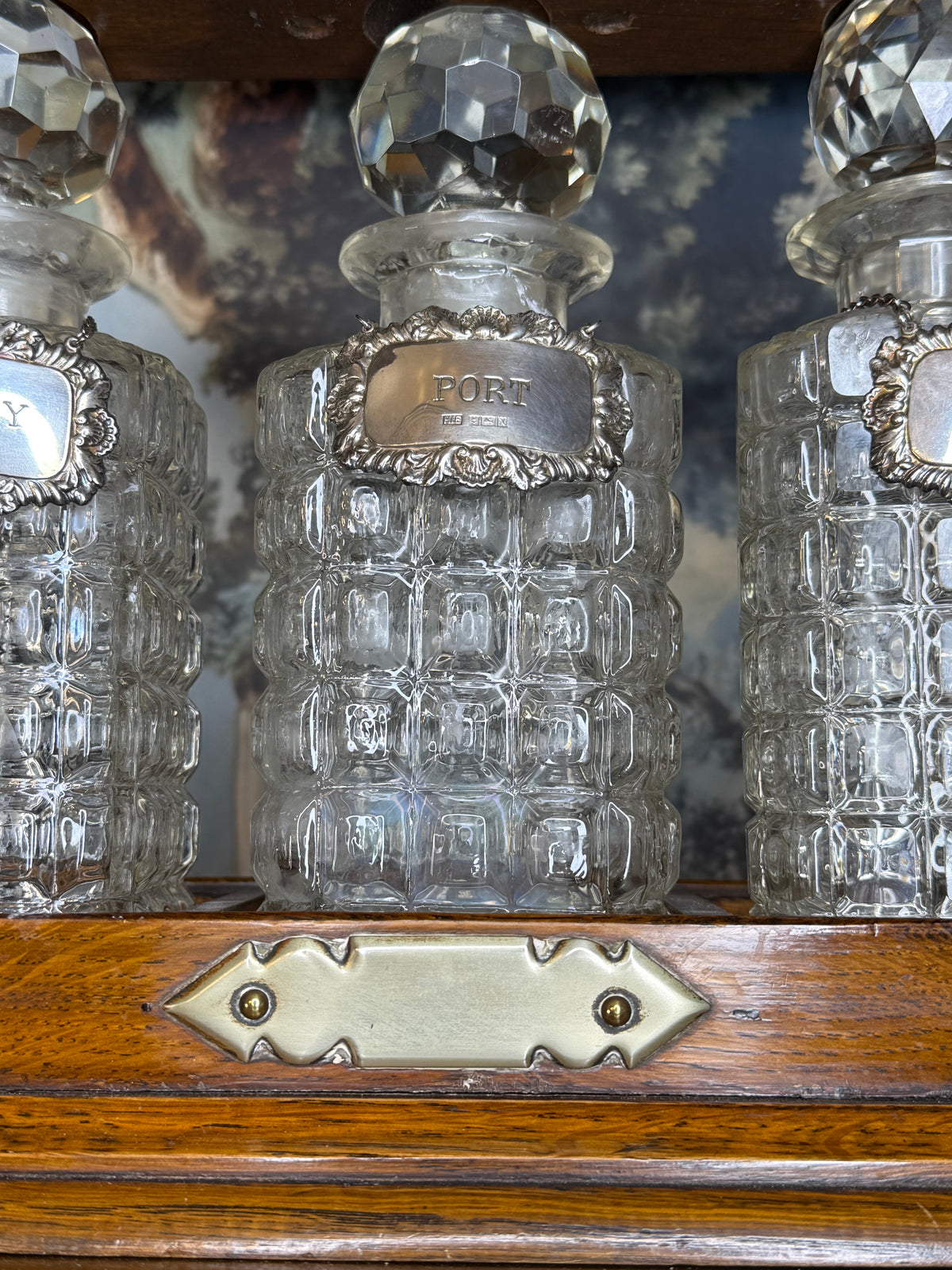 Antique English Oak Three-Bottle Tantalus W/ Cut Crystal Decanters, Sterling Silver Labels & Original Key, c.1900, 15” W x 13” H x 6.5” D