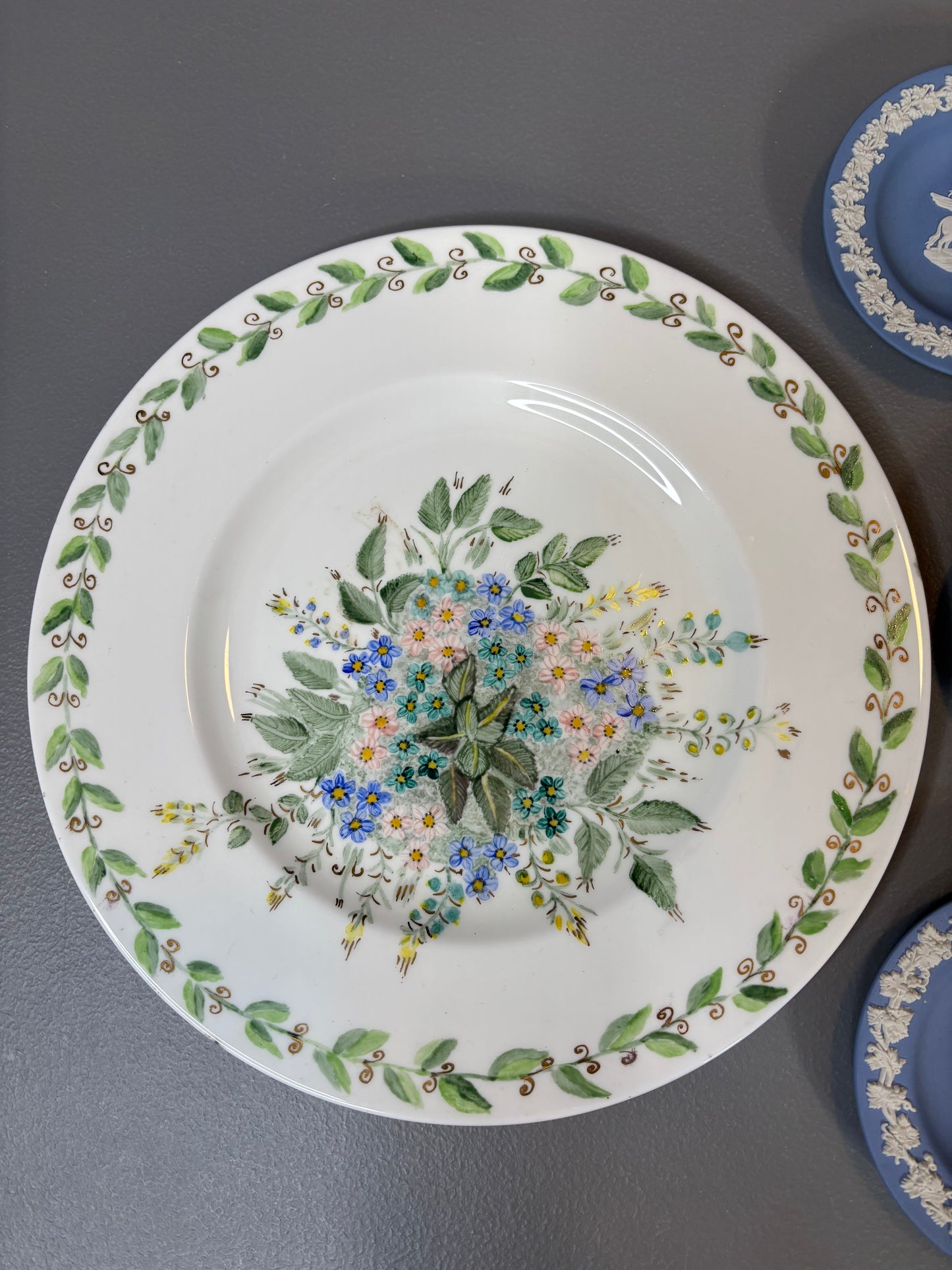 Instant plate wall! Features a handpainted floral plate signed and 3 Wedgwood trinket dishes!