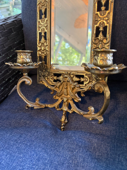 Stunning mirrored brass sconces pair with koi fish, ornate details, and tassel design!