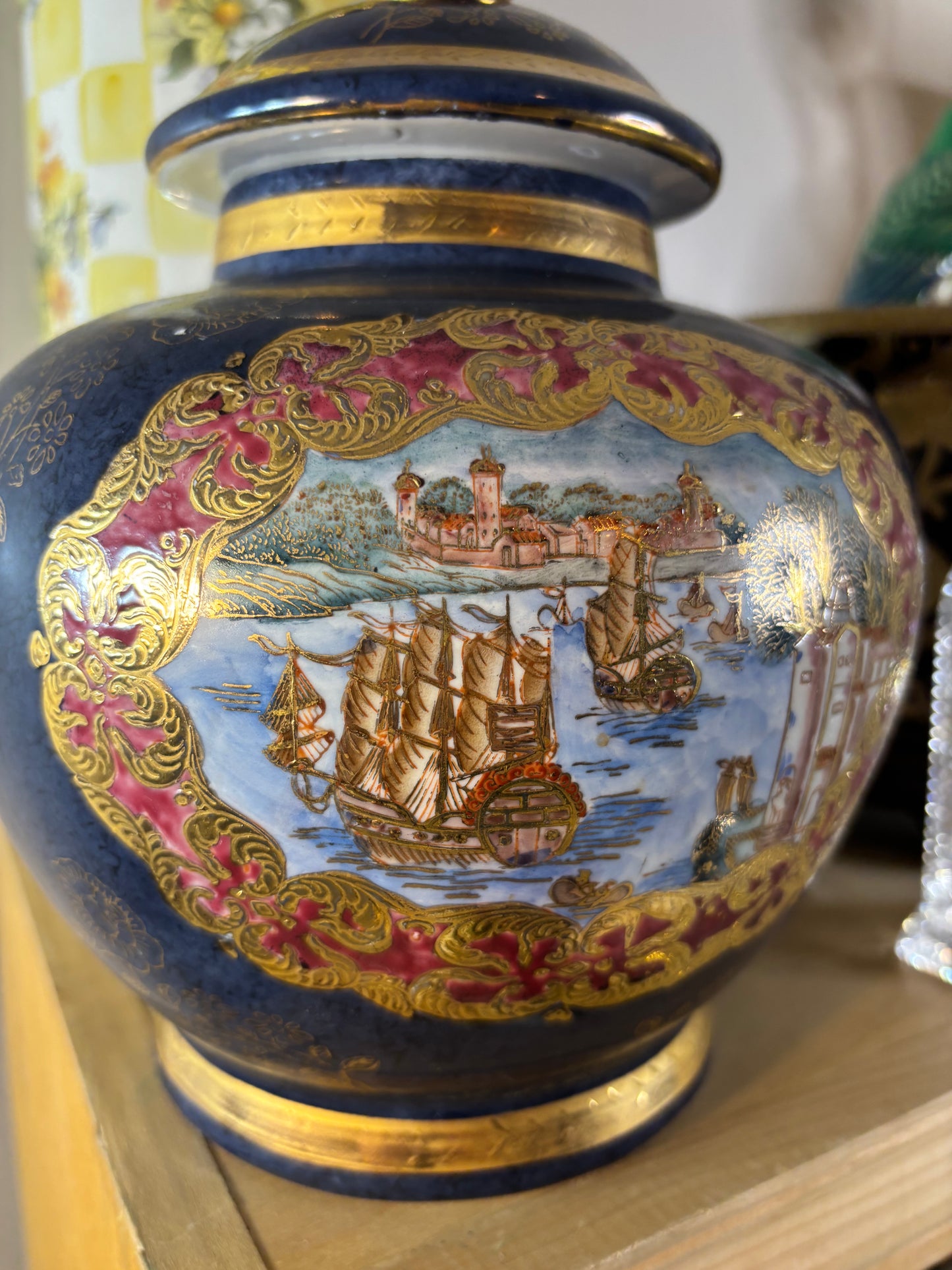 Cobalt lidded jar featuring ship scenes and gold details!