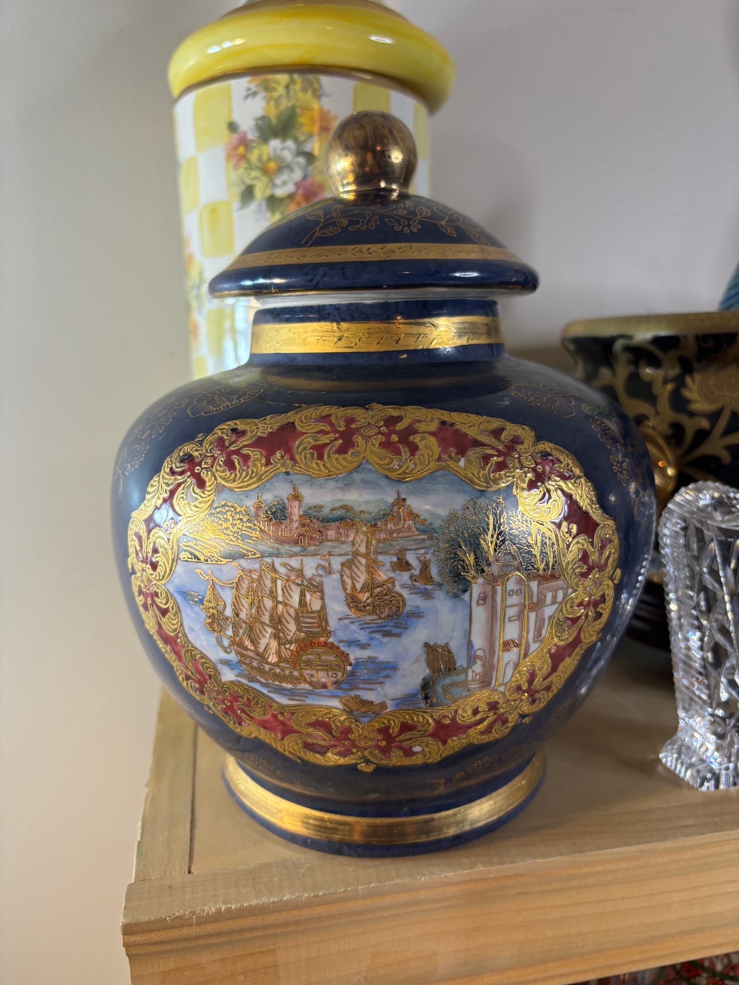 Cobalt lidded jar featuring ship scenes and gold details!