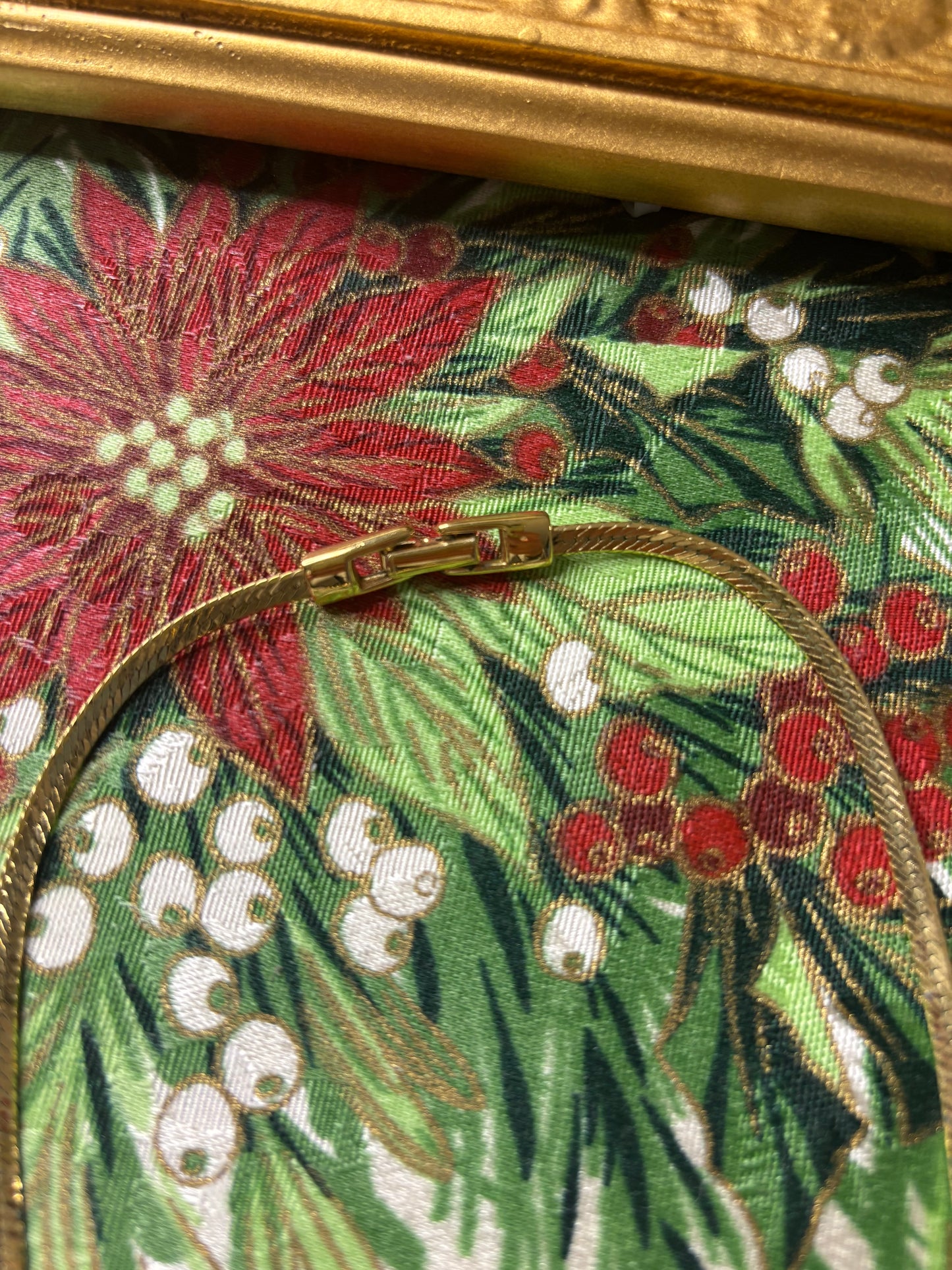 Stunning vintage Givenchy gold plated herringbone chain necklace with a crystal bow pendant!