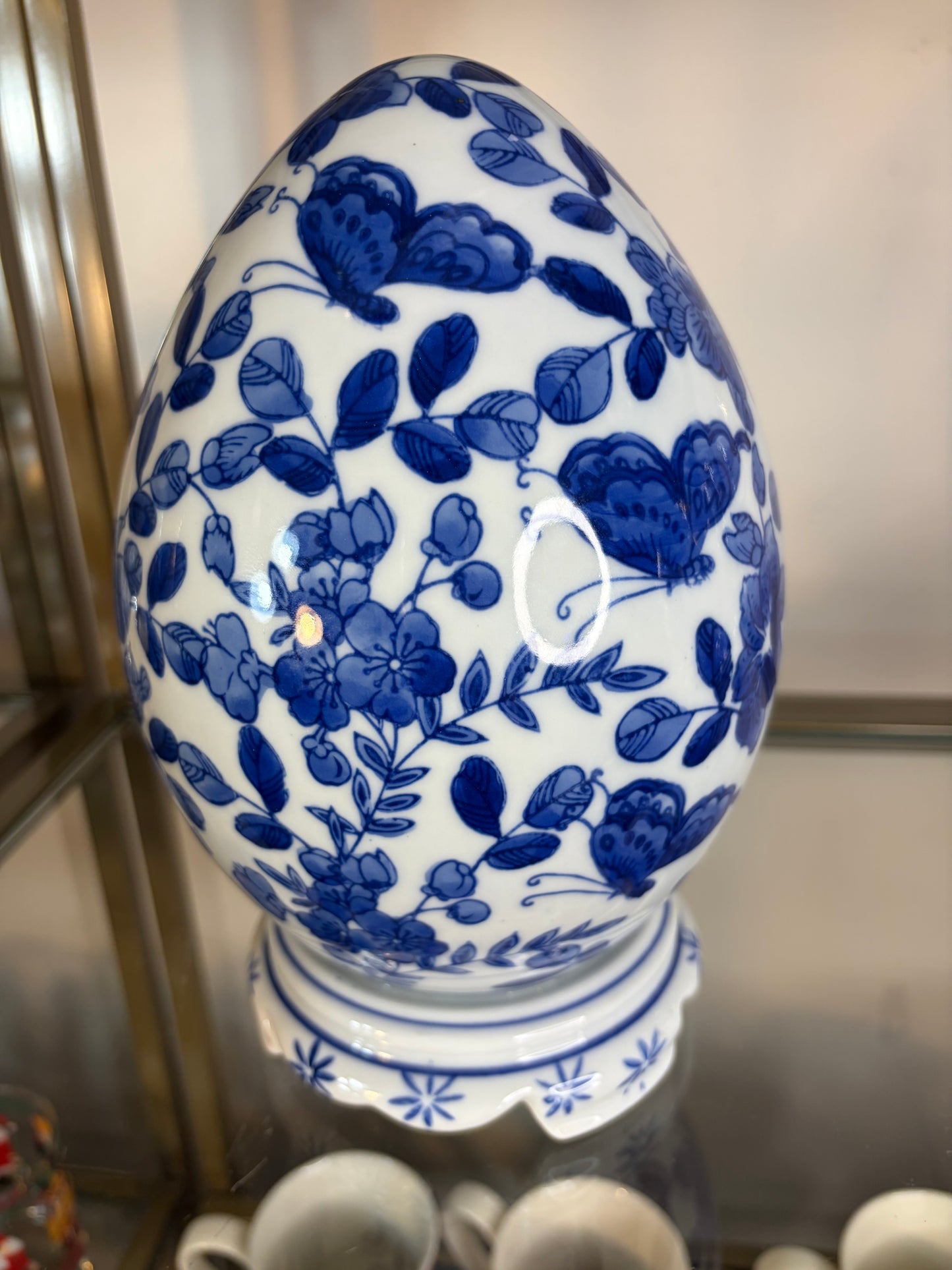 Chinoiserie blue and white floral egg with butterflies on attached stand!