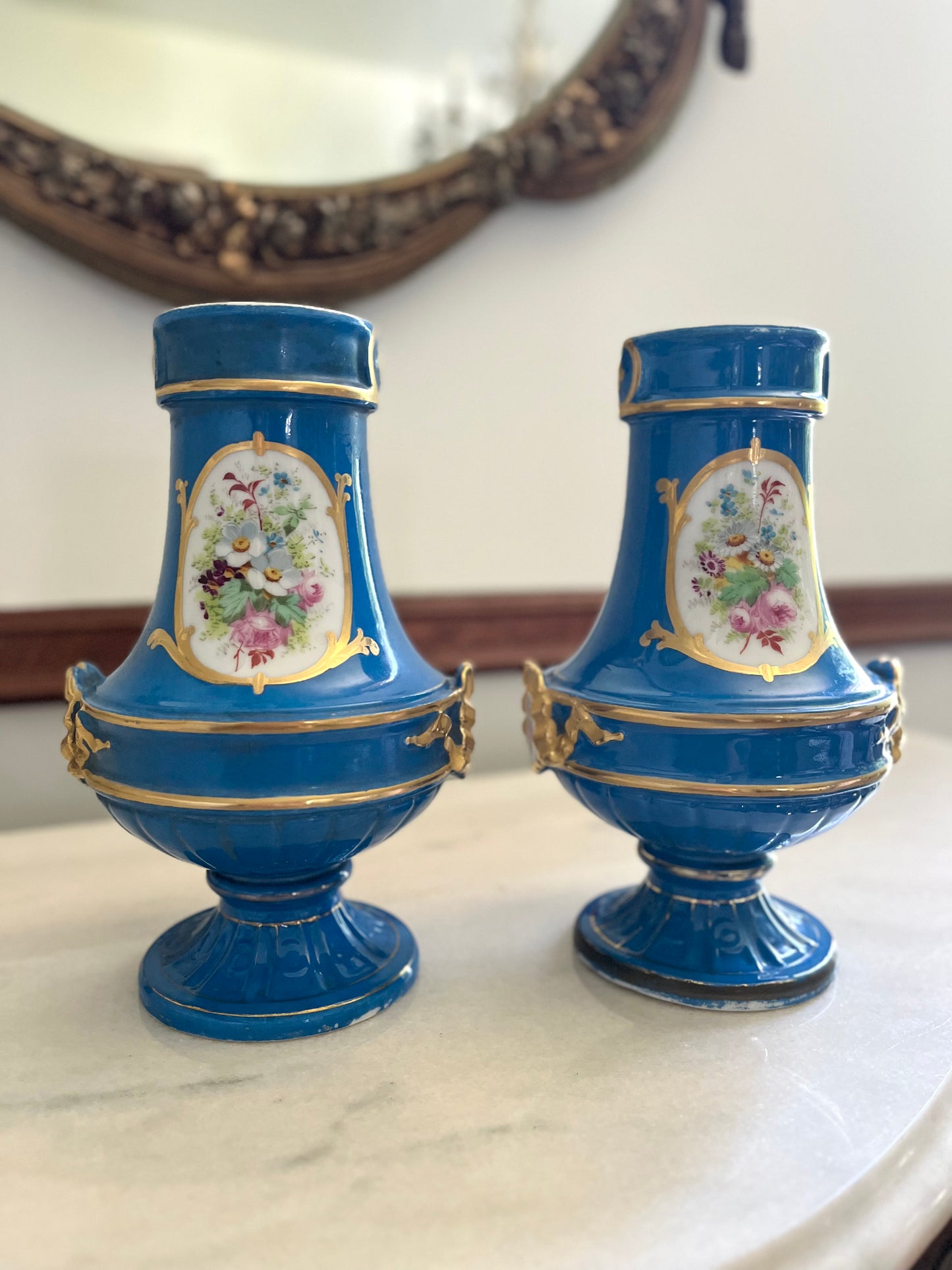 Elegant Pair of Antique 19th Century French Sèvres Style Porcelain Vases In Céleste Bleu With Hand-Painted Putti And Florals