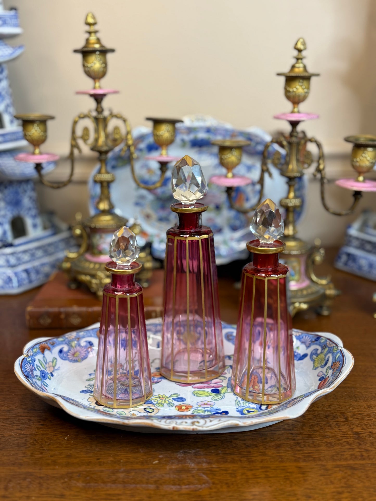 Set of 3 Cranberry Cut Crystal Perfume Bottles with Gilt Detail & Faceted Stoppers, c. 1930s–50s (8.5”, 6.5”, 6”)