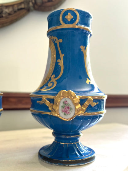 Elegant Pair of Antique 19th Century French Sèvres Style Porcelain Vases In Céleste Bleu With Hand-Painted Putti And Florals