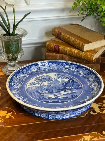 RESERVED - ROOTBERNADETTE- Antique John Meir Staffordshire “River Fishing” Pedestal Dish | Blue & White Transferware | Wild Rose Border | c. 1820s–1830s