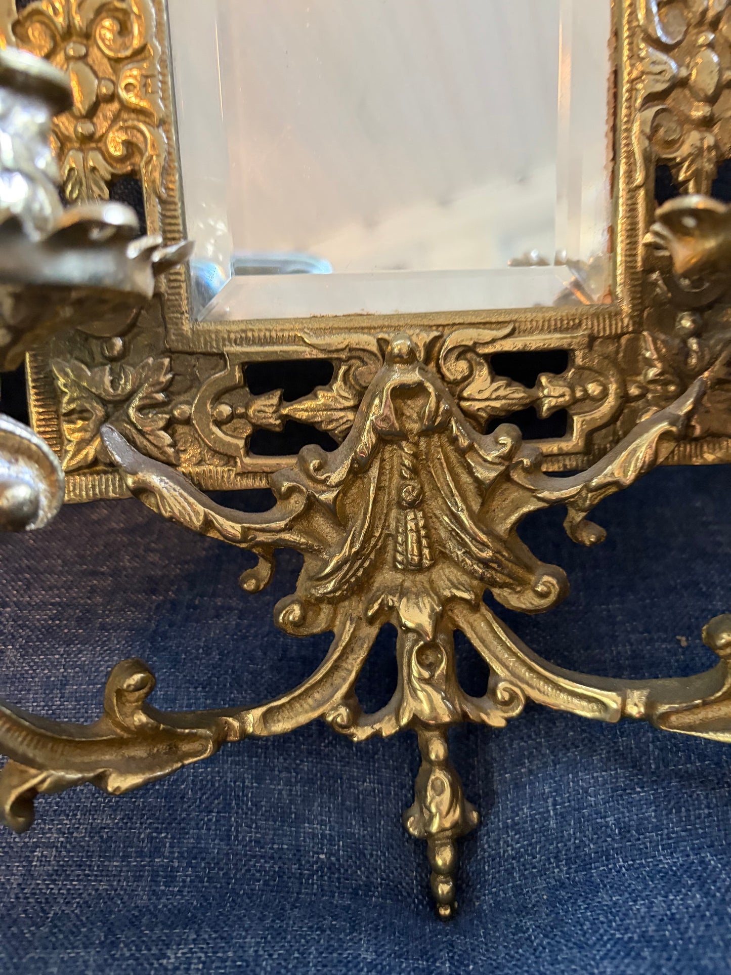 Stunning mirrored brass sconces pair with koi fish, ornate details, and tassel design!