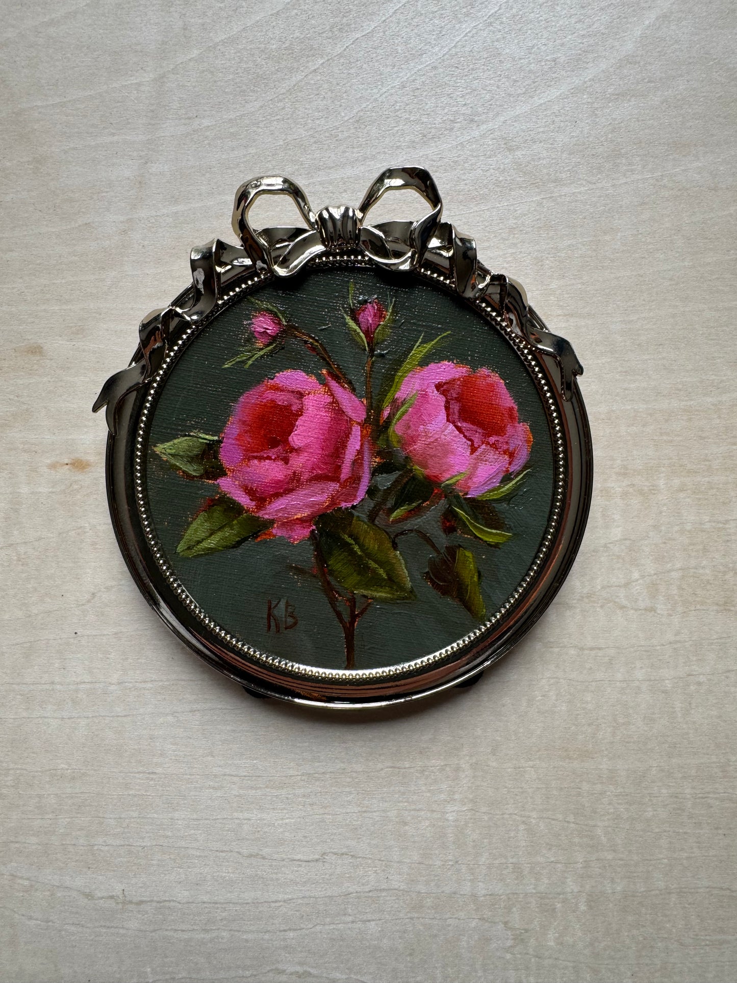 Pink roses sage green background