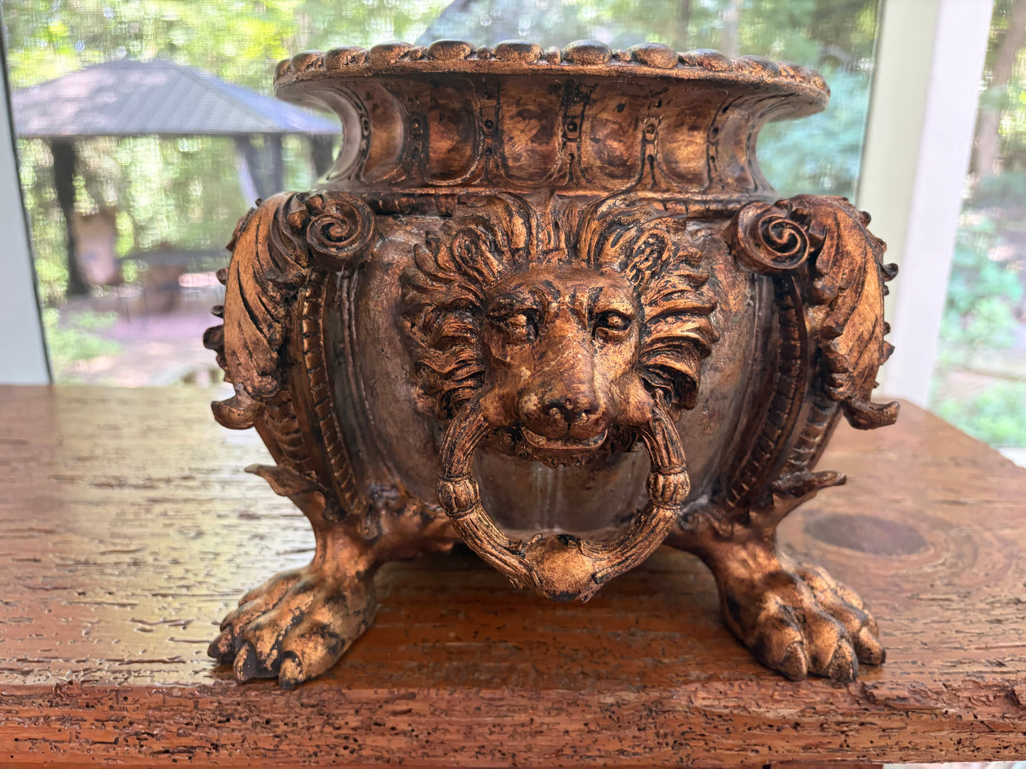 Striking composite lion head and claw feet footbath planter!