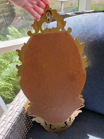 Beautiful Syroco wall mirror with an integrated shelf featuring an ornate gilt gold frame!