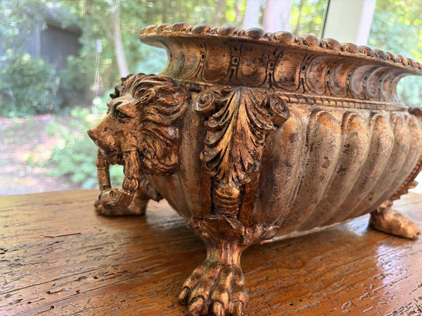Striking composite lion head and claw feet footbath planter!