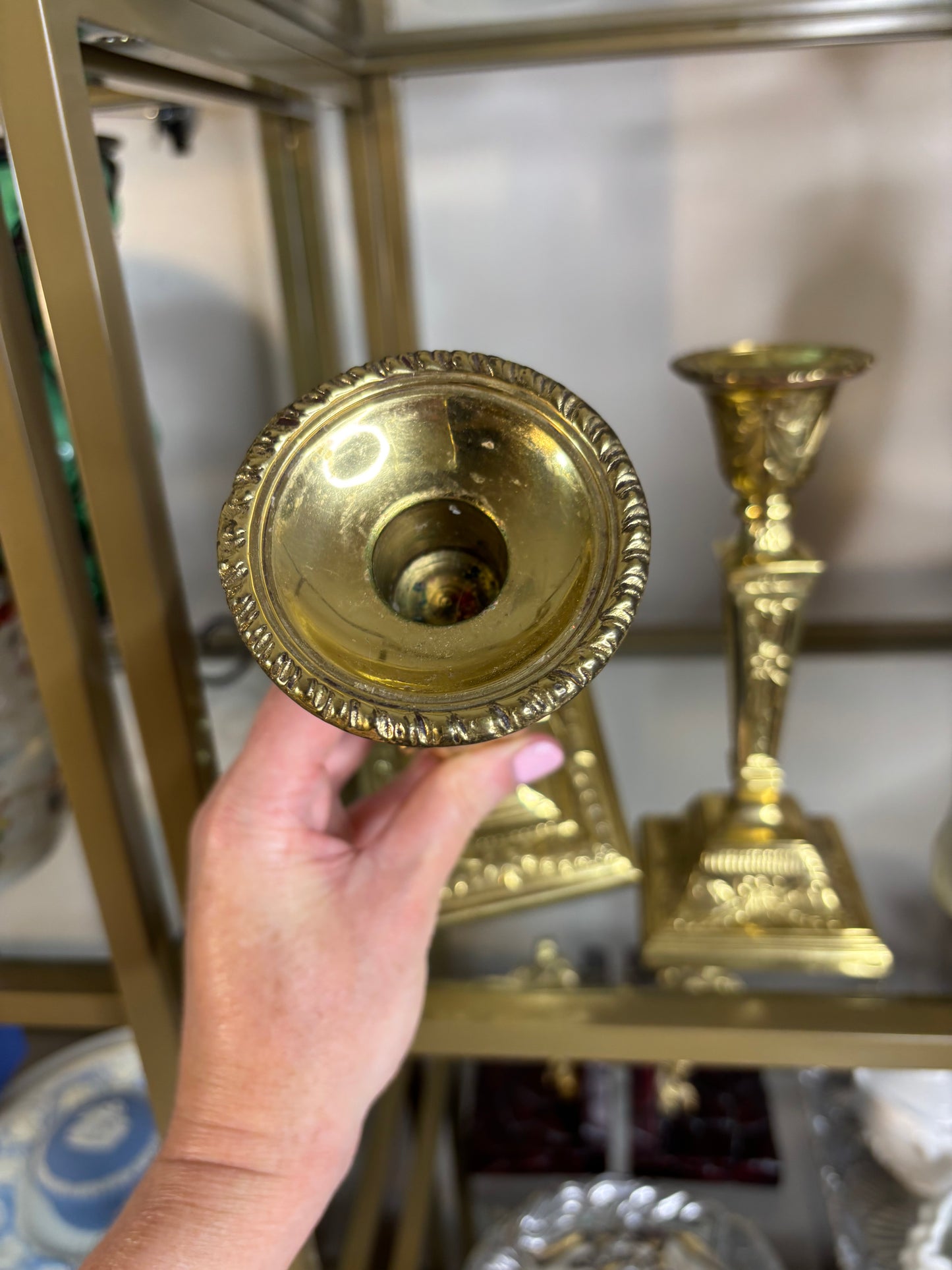 Beautiful brass candleholders pair featuring bows and ribbon designs!