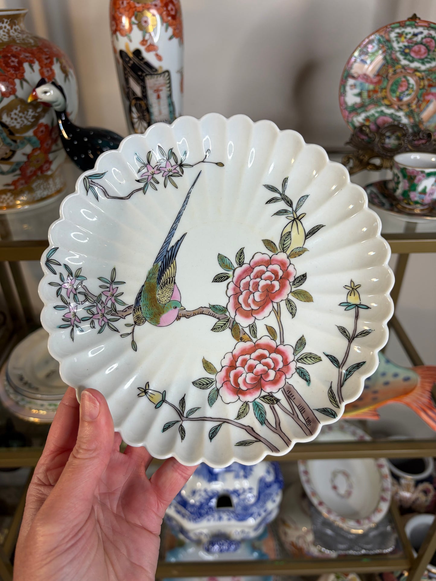 Lovely handpainted bird plate with scalloped edges and pink flowers!