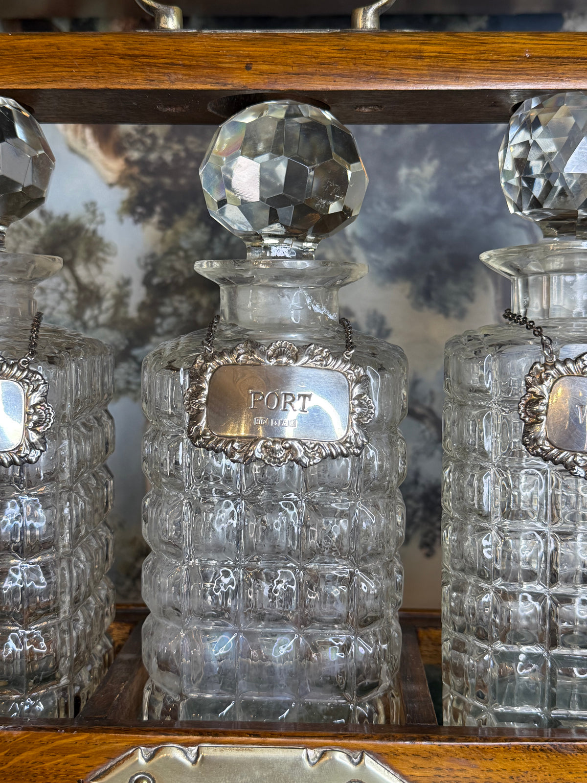 Antique English Oak Three-Bottle Tantalus W/ Cut Crystal Decanters, Sterling Silver Labels & Original Key, c.1900, 15” W x 13” H x 6.5” D
