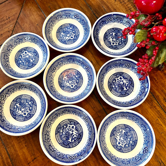 Set of eight vintage blue willow blue & white saucer bowls.