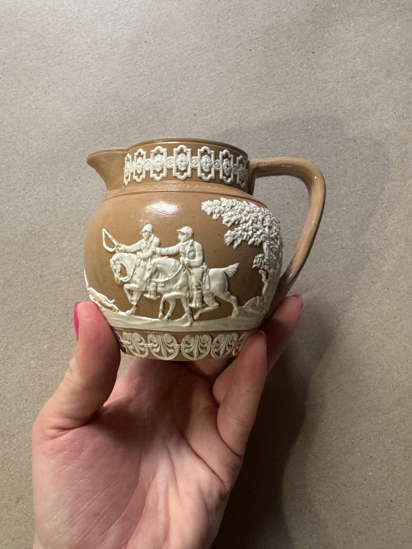 Light brown Wedgwood antique pitcher with hunting scene 4”