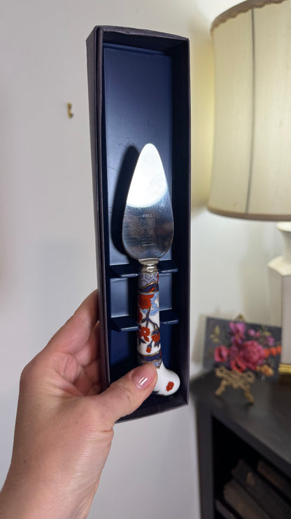 Reserved cheese cutter with porcelain handle