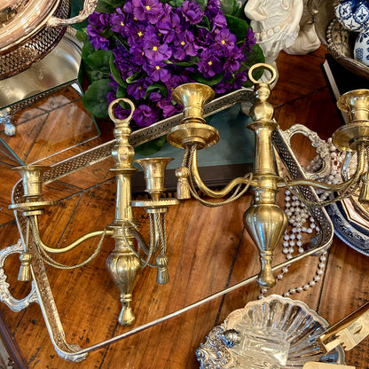 Stunning aged vintage pair of Hollywood Regency brass double wall candelabras.